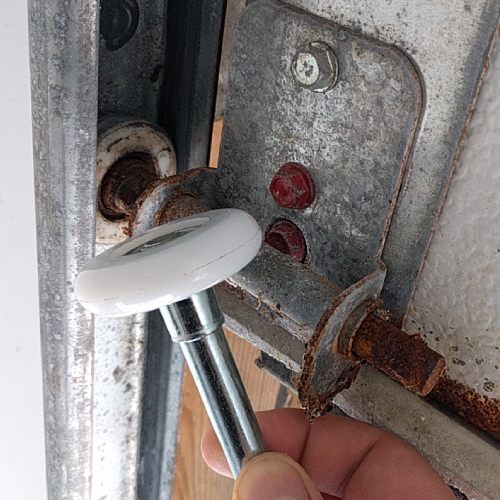New garage door roller vs old